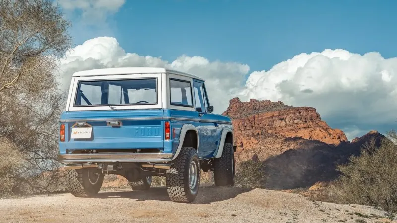 Blue Bronco In Mountains