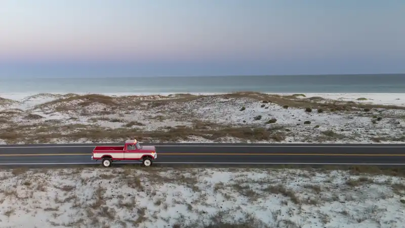 Restomod Turck Driving on the Beach