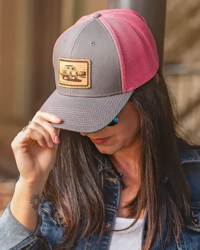 Woman wearing Velocity Restorations ball cap hat
