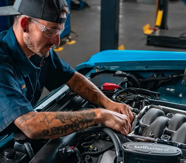 Technician working in Bronco engine bay