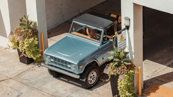 Classic Ford Bronco leaving a car park
