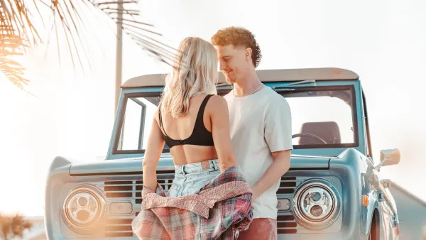 A couple near a restored classic Bronco