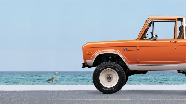 Classic Ford Bronco with the ocean in the background