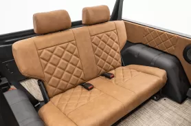https://www.velocityrestorations.com/assets/vehicles/1027-1977black-midnight-edition0026custom-rear-seats-sm.webp
