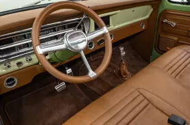 https://www.velocityrestorations.com/assets/vehicles/2799-1970-green-ford-f250-14-15-driver-side-interior-sm.webp