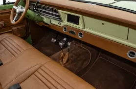 https://www.velocityrestorations.com/assets/vehicles/2801-1970-green-ford-f25018-passenger-side-interior-sm.webp