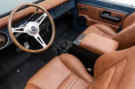 https://www.velocityrestorations.com/assets/vehicles/3338-1972-velocity-classic-ford-bronco-14-15-driver-side-interior-sm.webp