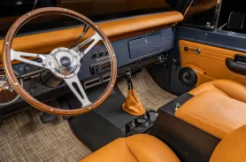https://www.velocityrestorations.com/assets/vehicles/3422-1969-classic-ford-bronco-14-15-driver-side-interior-sm.webp