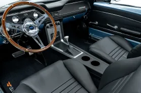 https://www.velocityrestorations.com/assets/vehicles/3786-1968-brittany-blue-ford-mustang-14-15-driver-side-interior-sm.webp