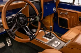 https://www.velocityrestorations.com/assets/vehicles/3898-1973-classic-ford-bronco-hardtop-14-15-driver-side-interior-sm.webp
