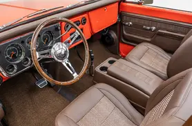 https://www.velocityrestorations.com/assets/vehicles/4069-1970-orange-chevrolwt-k5-blazerexterior-14-15-driver-side-interior-sm.webp